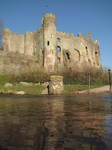 SX17753 Laugharne castle reflected in river Coran.jpg
